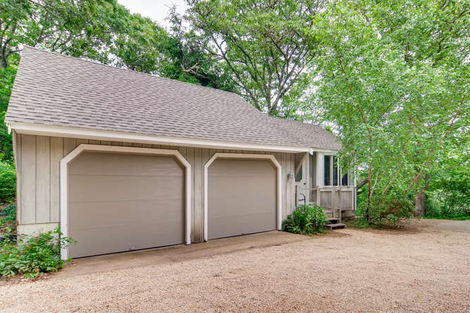 345 N Road Chilmark, MA 02535 - Photo 3 of 26 a backyard of a house with plants and trees