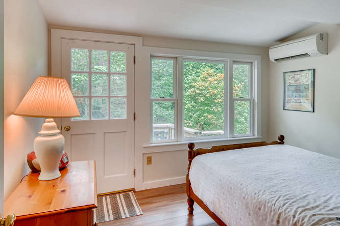 345 N Road Chilmark, MA 02535 - Photo 21 of 26 a bedroom with a bed and a window