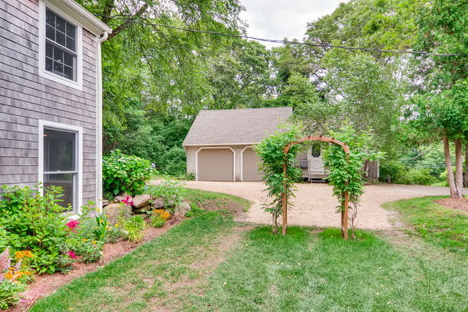 345 N Road Chilmark, MA 02535 - Photo 6 of 26 a view of a house with a yard and sitting area