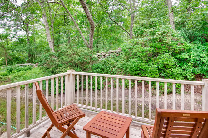 345 N Road Chilmark, MA 02535 - Photo 8 of 26 a view of a two chairs in the deck
