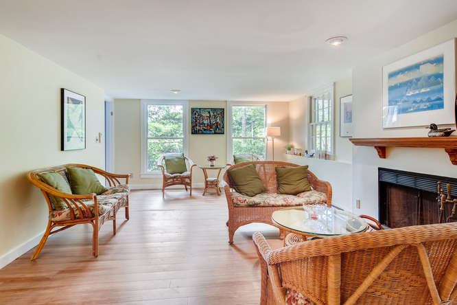 345 N Road Chilmark, MA 02535 - Photo 10 of 26 a living room with furniture fireplace and window