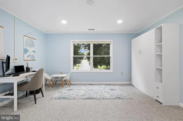 a workspace with furniture and window