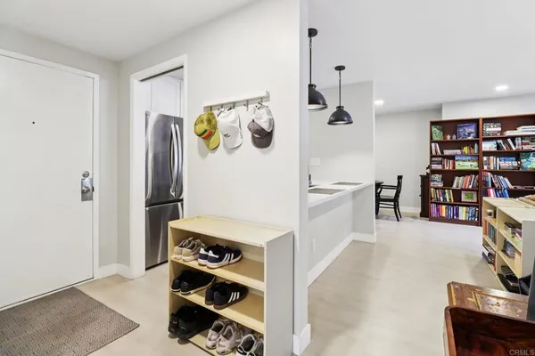 a room with furniture and white walls