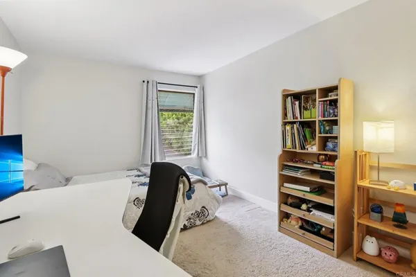 a bedroom with a bed and a closet