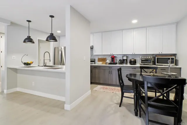 a kitchen with a table and chairs in it
