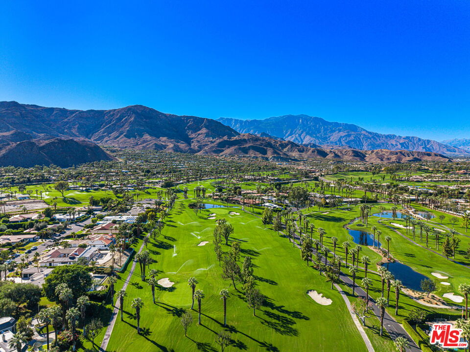 71150 North Thunderbird Terrace Rancho Mirage, CA 92270 - Photo 11 of 75 a view of a lush green hillside and houses