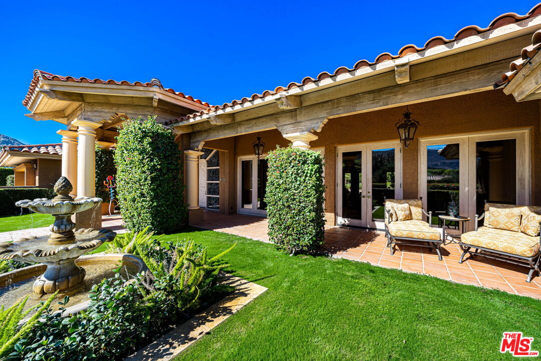 71150 North Thunderbird Terrace Rancho Mirage, CA 92270 - Photo 15 of 75 front view of a house with a yard