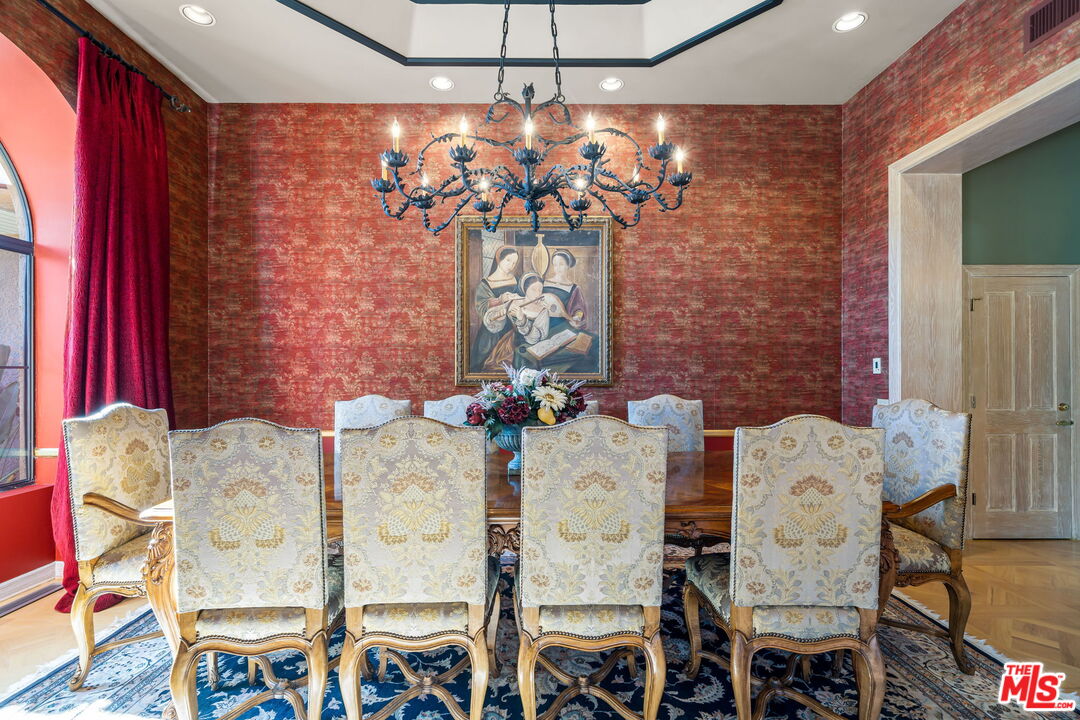 71150 North Thunderbird Terrace Rancho Mirage, CA 92270 - Photo 17 of 75 a view of a dining room with furniture and chandelier