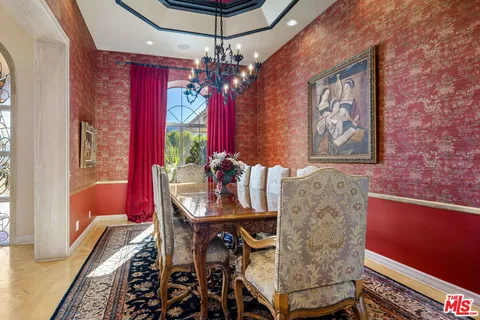 a living room with furniture fireplace and window