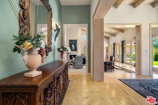 a living room with furniture fireplace and window