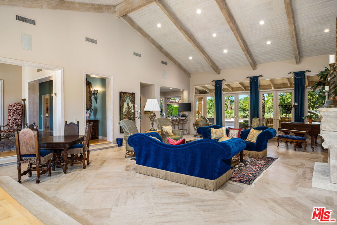 71150 North Thunderbird Terrace Rancho Mirage, CA 92270 - Photo 23 of 75 a living room with furniture and a large window