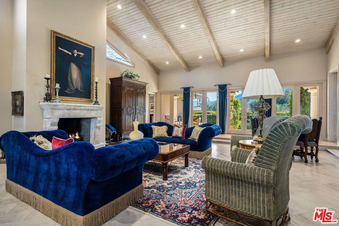 71150 North Thunderbird Terrace Rancho Mirage, CA 92270 - Photo 25 of 75 a living room with furniture fireplace and window