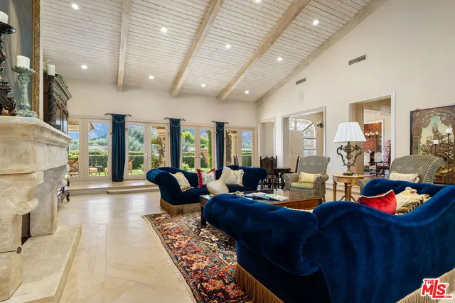 a kitchen with stainless steel appliances granite countertop a sink a stove and a microwave oven