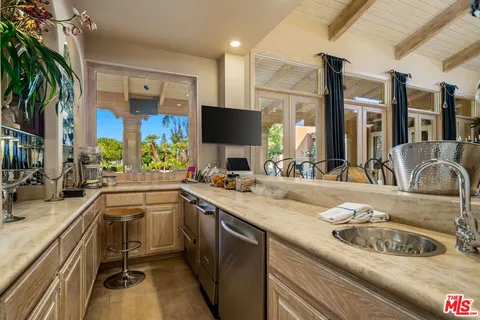 a spacious bathroom with a double vanity sink and a mirror