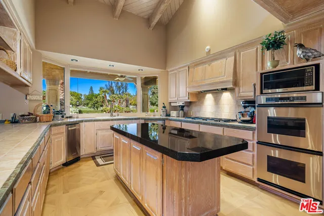 a view of a dining room with furniture wooden floor and chandelier