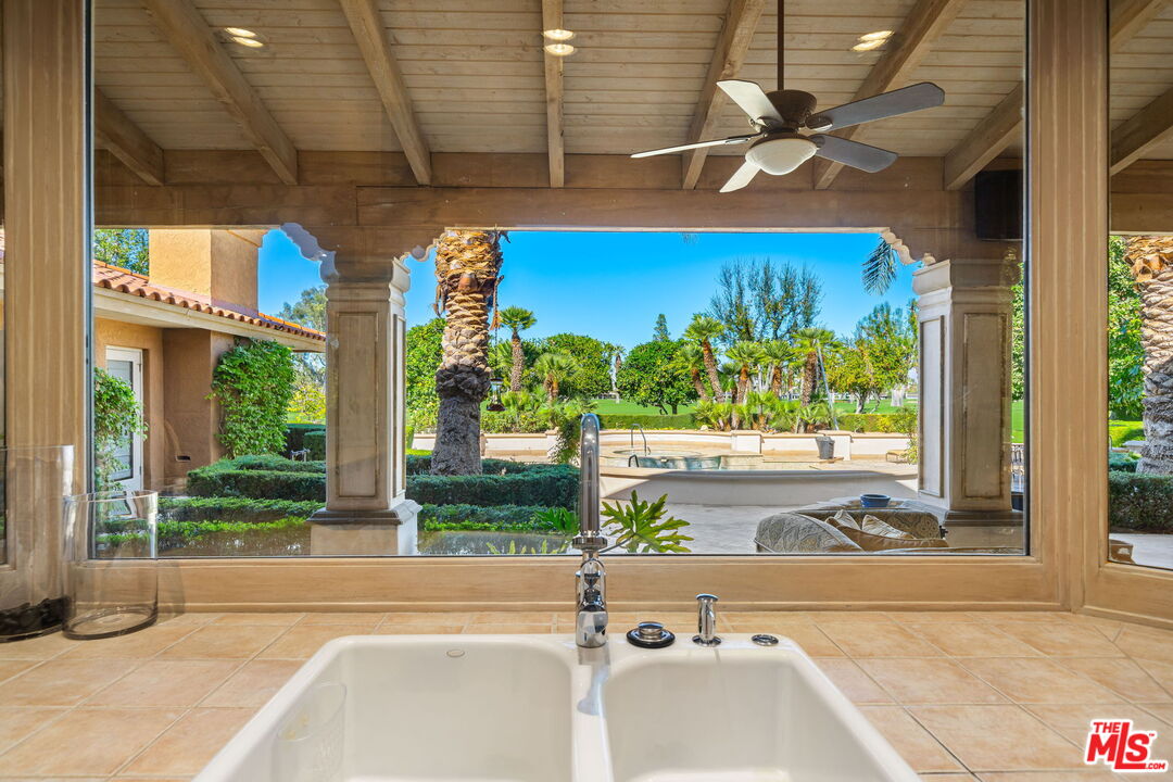 71150 North Thunderbird Terrace Rancho Mirage, CA 92270 - Photo 36 of 75 a view of a room with a large window and wooden floor