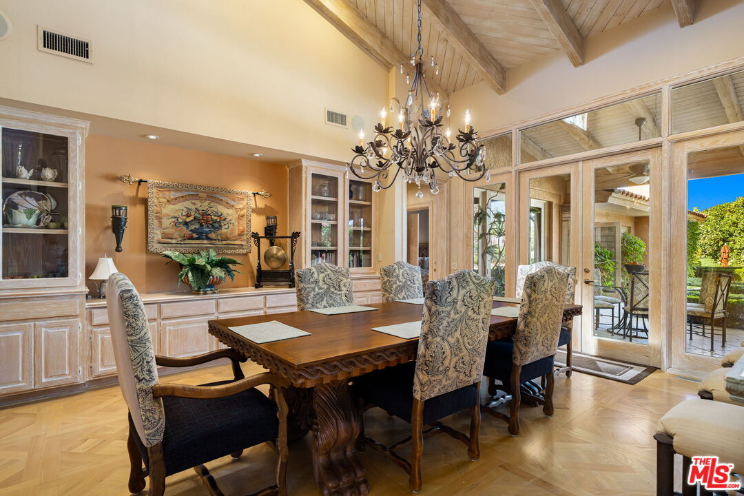 71150 North Thunderbird Terrace Rancho Mirage, CA 92270 - Photo 37 of 75 a view of a dining room with furniture window and wooden floor