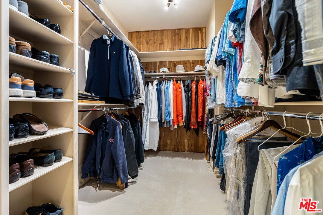 71150 North Thunderbird Terrace Rancho Mirage, CA 92270 - Photo 48 of 75 a view of walk in closet with clothes and shoes