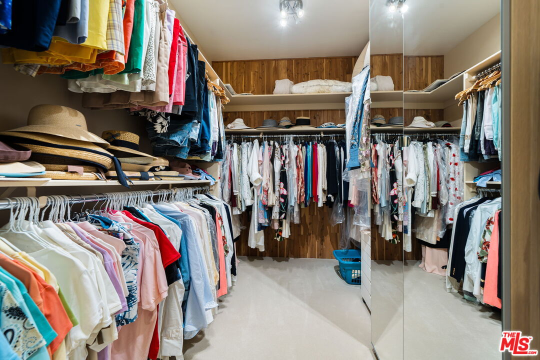71150 North Thunderbird Terrace Rancho Mirage, CA 92270 - Photo 49 of 75 a view of walk in closet with clothes and shoes