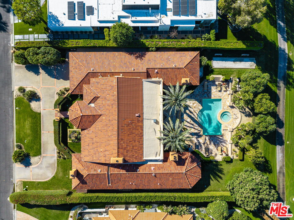 71150 North Thunderbird Terrace Rancho Mirage, CA 92270 - Photo 5 of 75 an aerial view of a house with a yard and potted plants