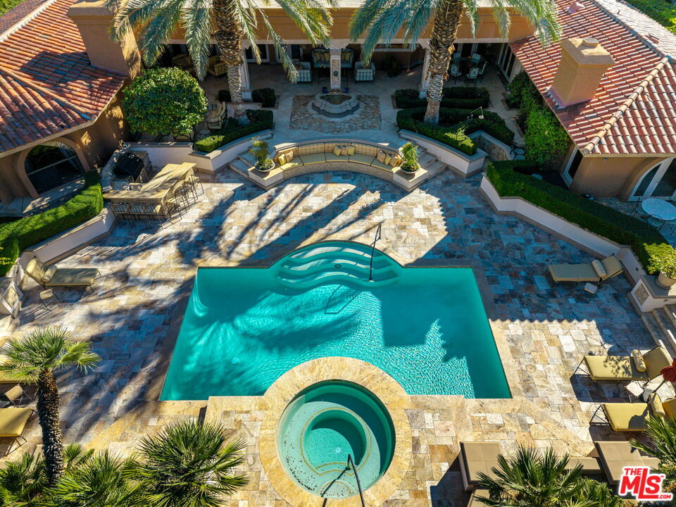 71150 North Thunderbird Terrace Rancho Mirage, CA 92270 - Photo 9 of 75 an aerial view of a house with a swimming pool