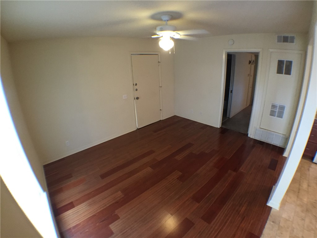 2800 Cole Street, Unit 103C Austin, TX 78705 - Photo 16 of 16 a view of empty room with wooden floor