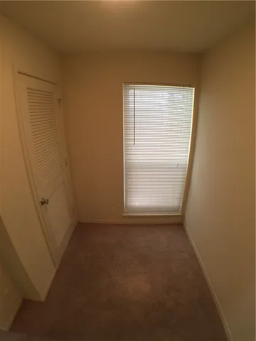 an empty room that has a window