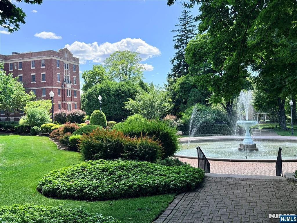 4201 Rio Vista Drive, Unit 4201 Mahwah, NJ 07430 - Photo 22 of 34 a view of yard with swimming pool and green space