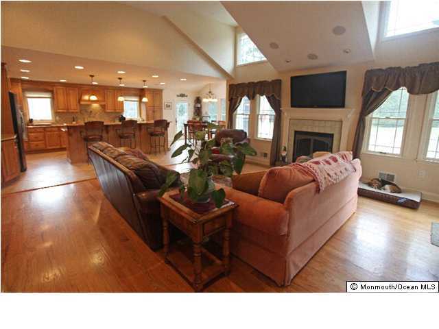 28 Ravine Road Middletown, NJ 07701 - Photo 2 of 3 a living room with furniture window and a fireplace