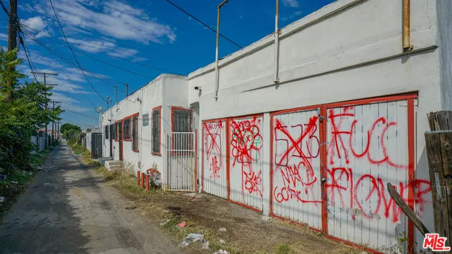 a view of a hallway with wooden walls