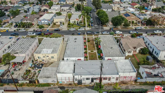 an aerial view of a house with outdoor space
