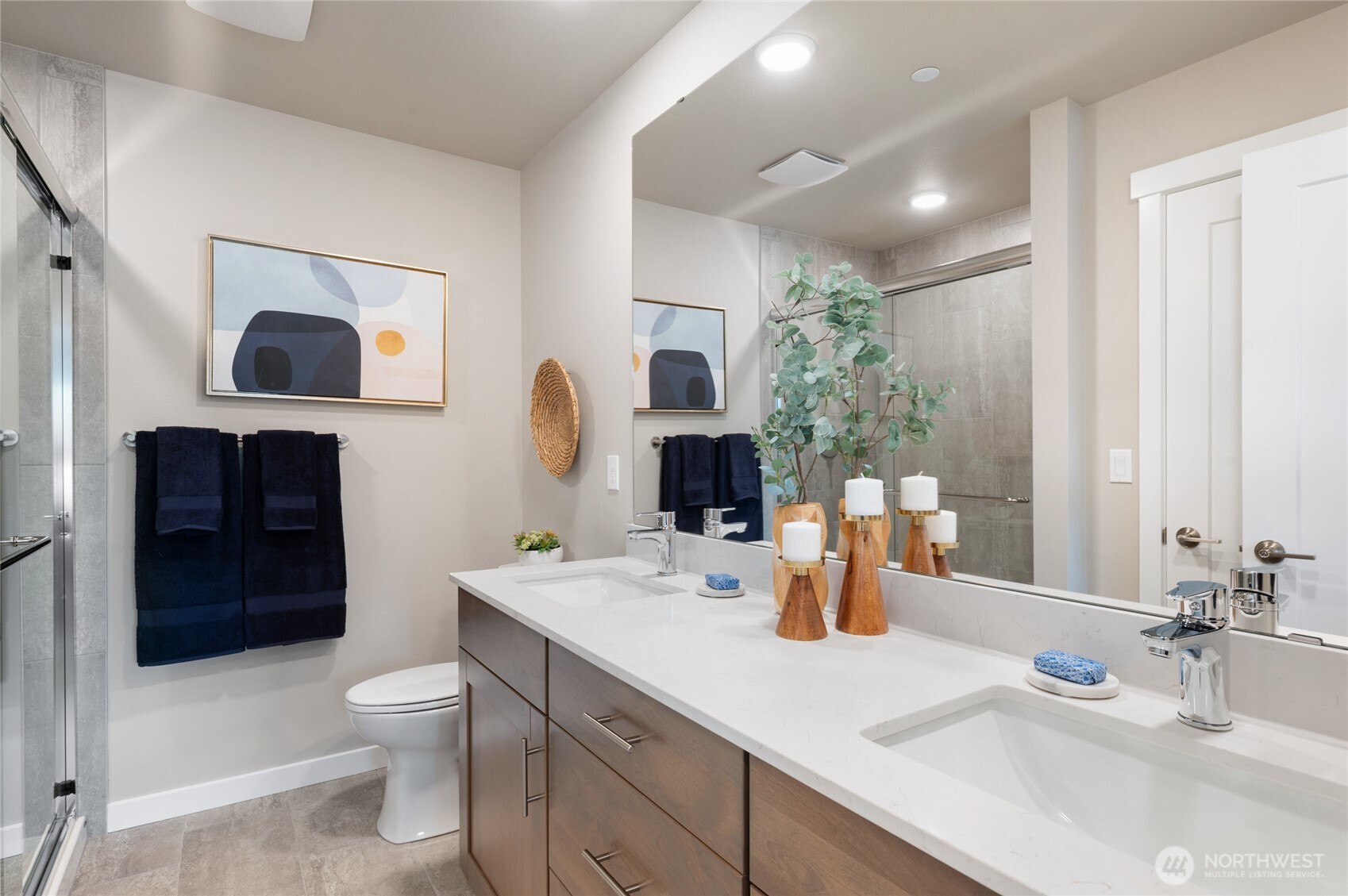 1322 194th Street Southeast, Unit D5 Bothell, WA 98012 - Photo 11 of 13 a bathroom with a toilet sink double vanity and mirror