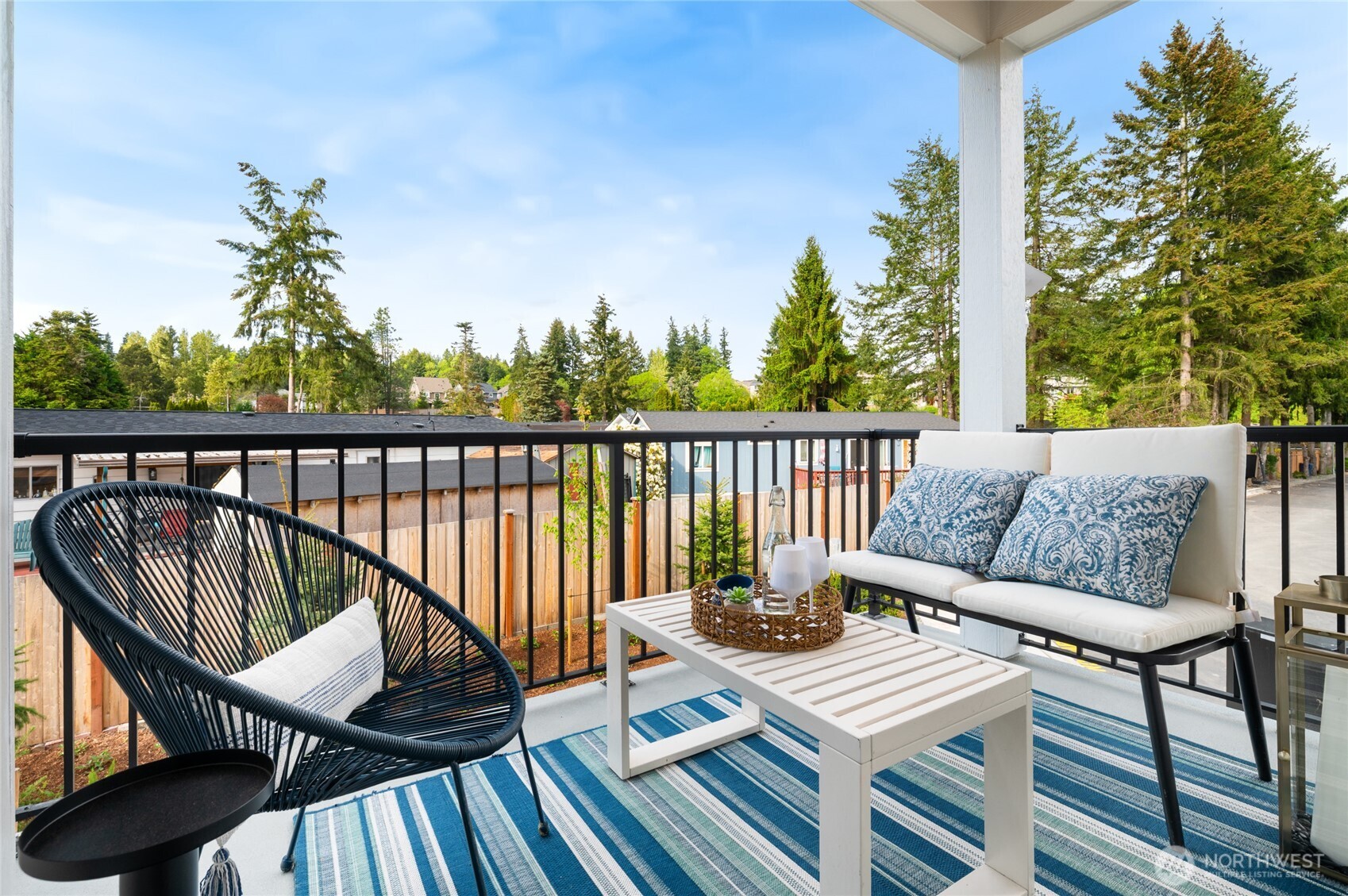 1322 194th Street Southeast, Unit D5 Bothell, WA 98012 - Photo 13 of 13 a view of a balcony with couches and wooden floor