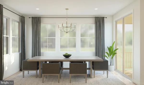 a view of a dining room with furniture and window