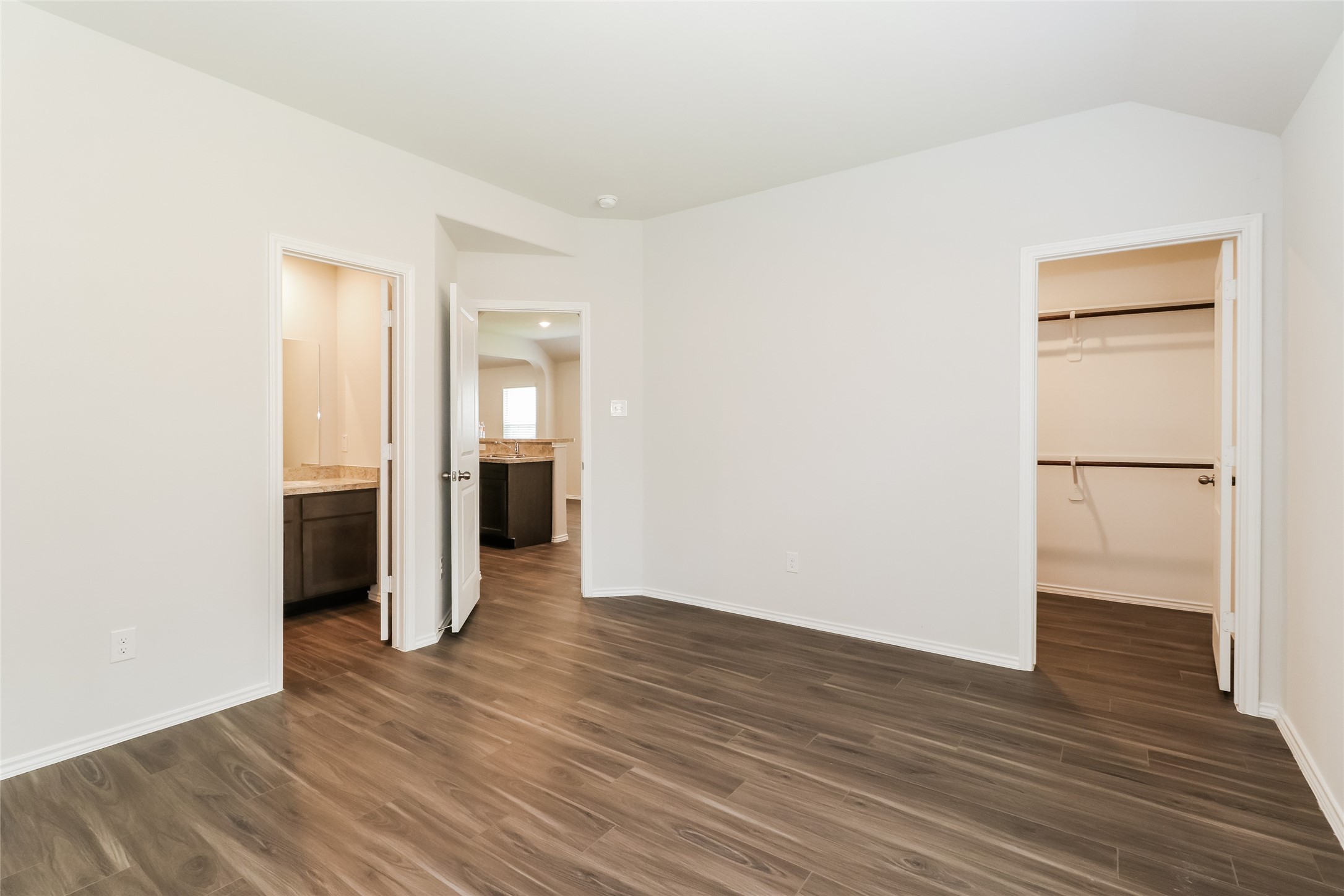 2257 Onyx Lane Conroe, TX 77301 - Photo 11 of 19 a view of an empty room with wooden floor and a window