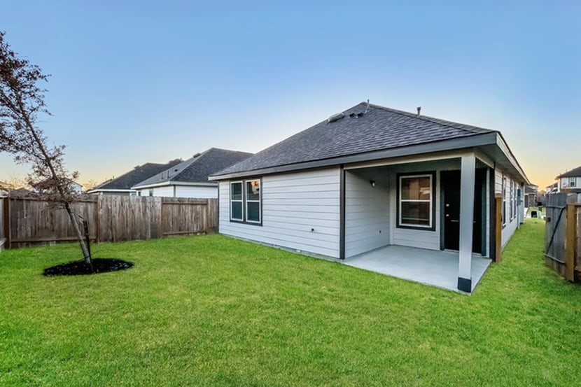 2257 Onyx Lane Conroe, TX 77301 - Photo 2 of 19 a view of a house with a yard and wooden fence