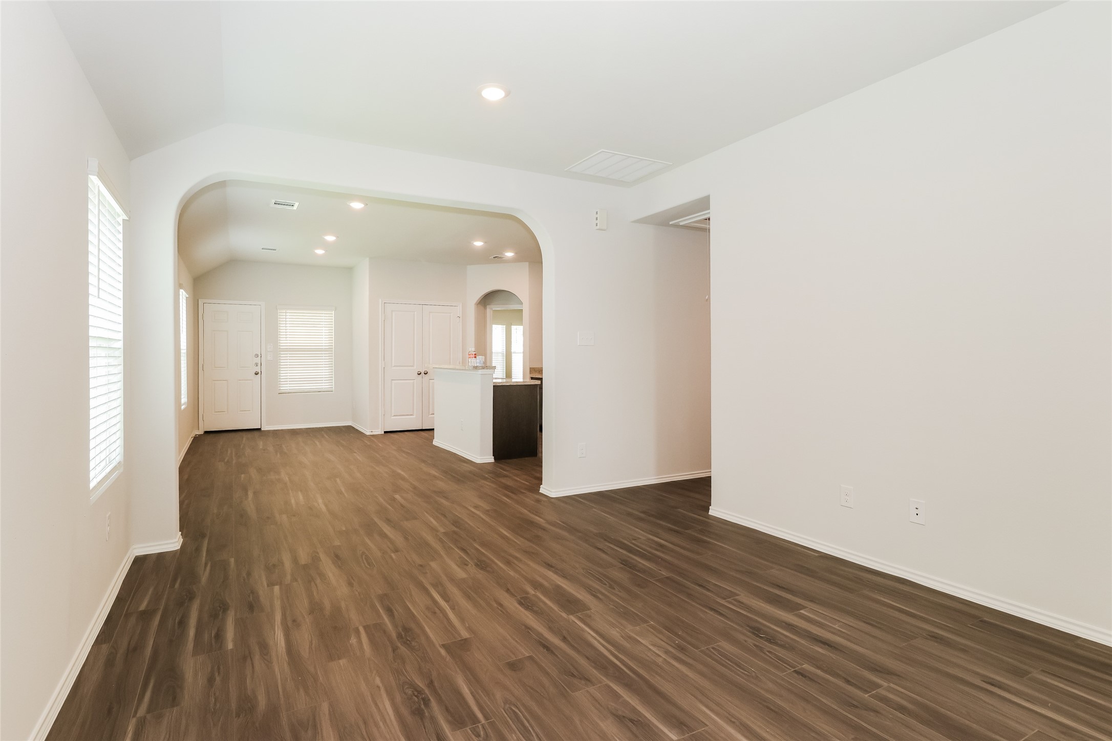 2257 Onyx Lane Conroe, TX 77301 - Photo 8 of 19 a view of empty room with wooden floor and windows