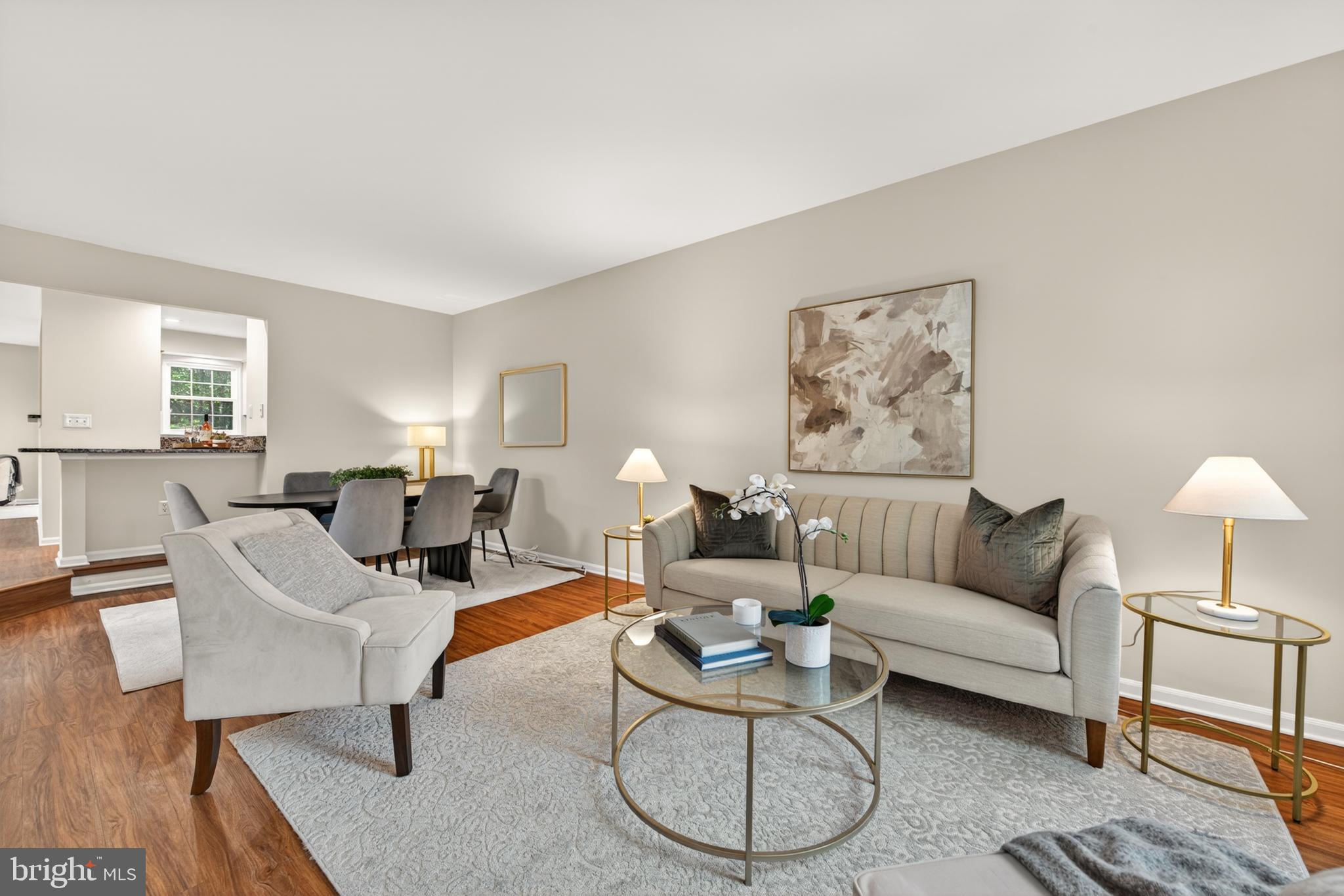 1409 Park Garden Lane Reston, VA 20194 - Photo 9 of 41 a living room with furniture a rug and a table