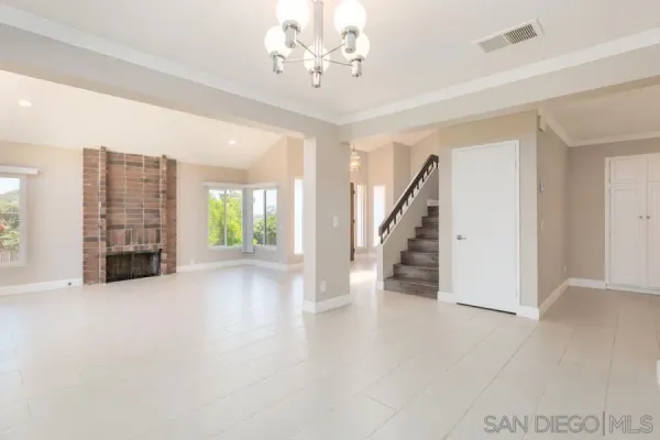 wooden floor in an empty room with a fireplace