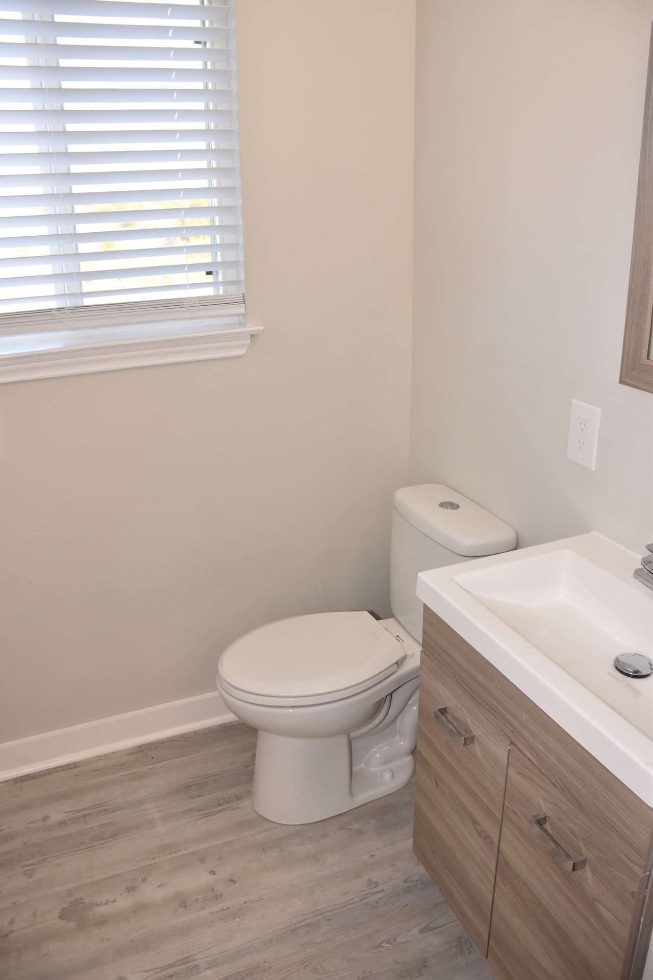3751 County Road 463 Elgin, TX 78621 - Photo 17 of 27 a bathroom with a toilet sink and window