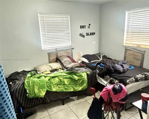 a bathroom with a sink mirror and vanity