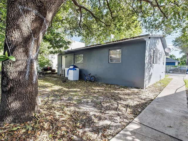 a backyard of a house with lots of green space