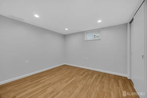 a view of a park with bench and trees