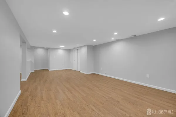 a view of a park with large trees