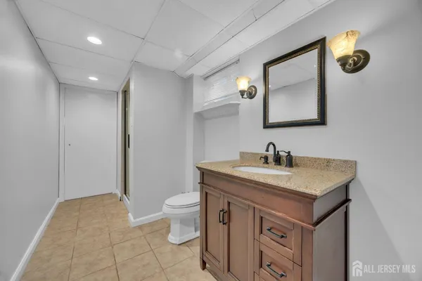 a view of backyard with plants and outdoor seating