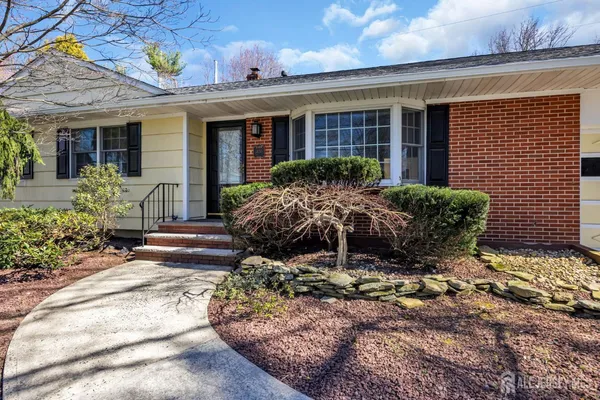 a house view with a garden space