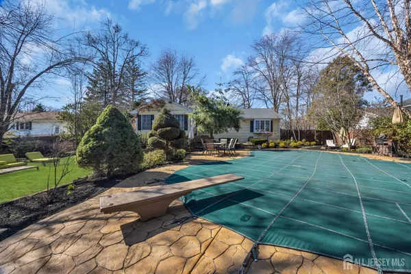 a view of a swimming pool with a patio