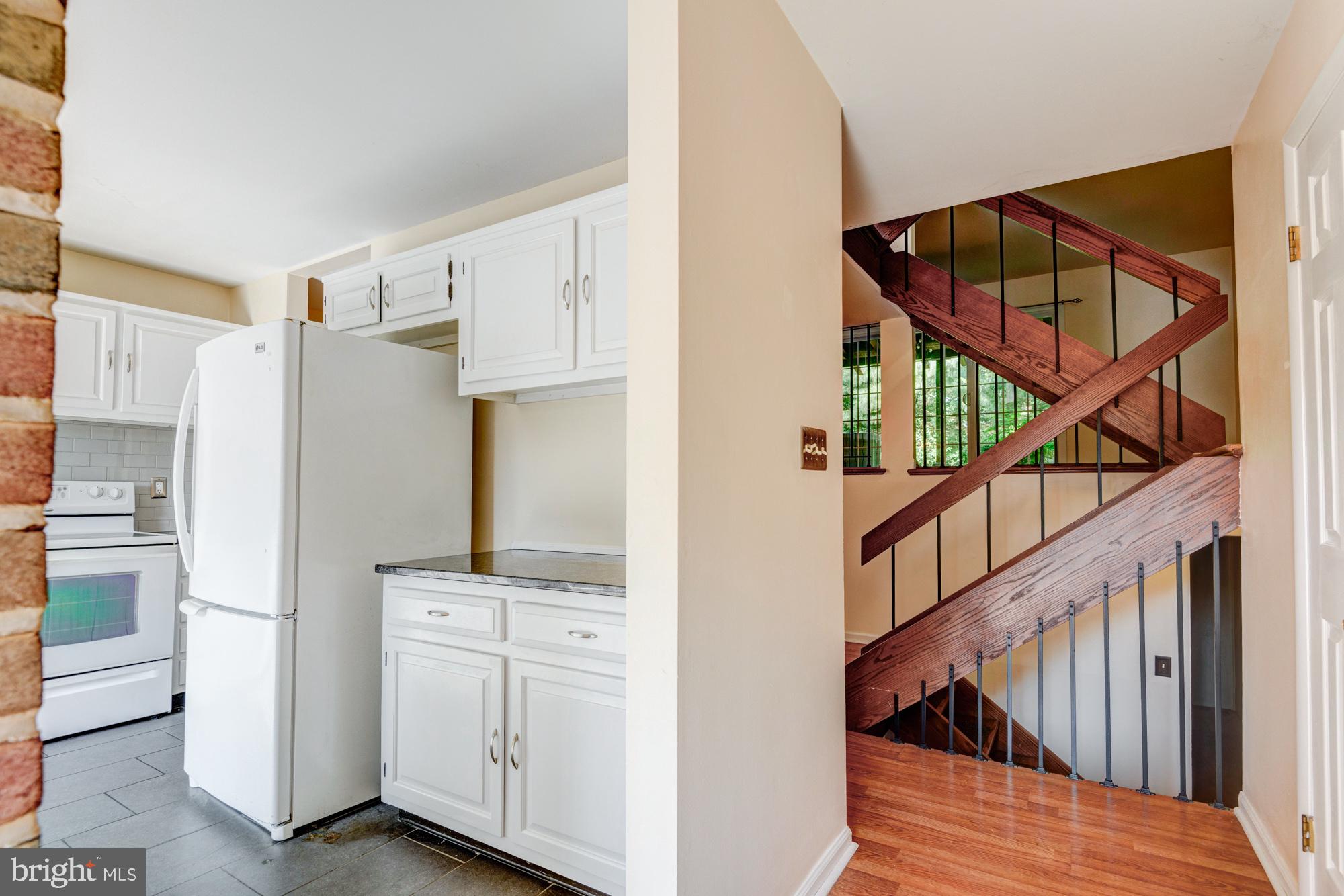 73 Wedge Lane Reading, PA 19607 - Photo 4 of 23 Modern kitchen meets inviting staircase.