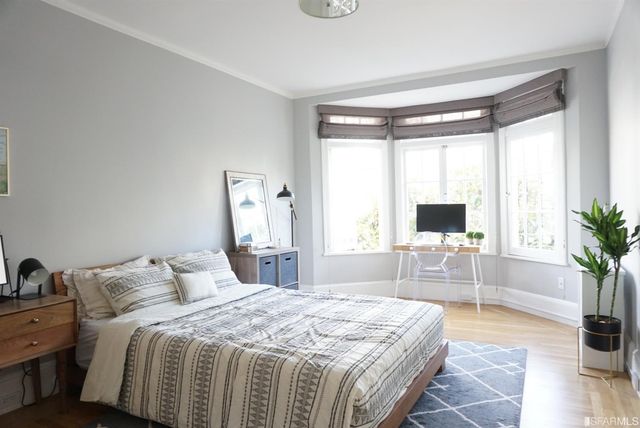 a view of a chairs and table in backyard