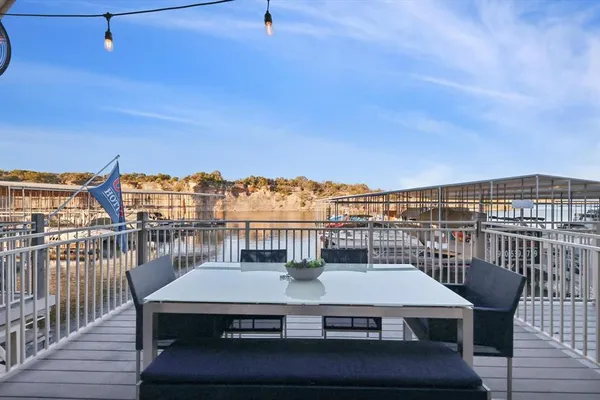 a view of a balcony with furniture